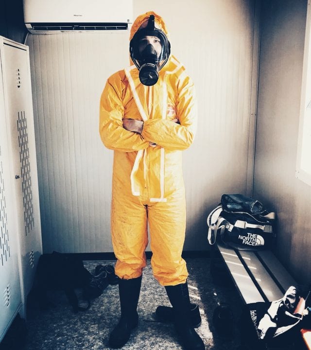 Worker in hazmat suit